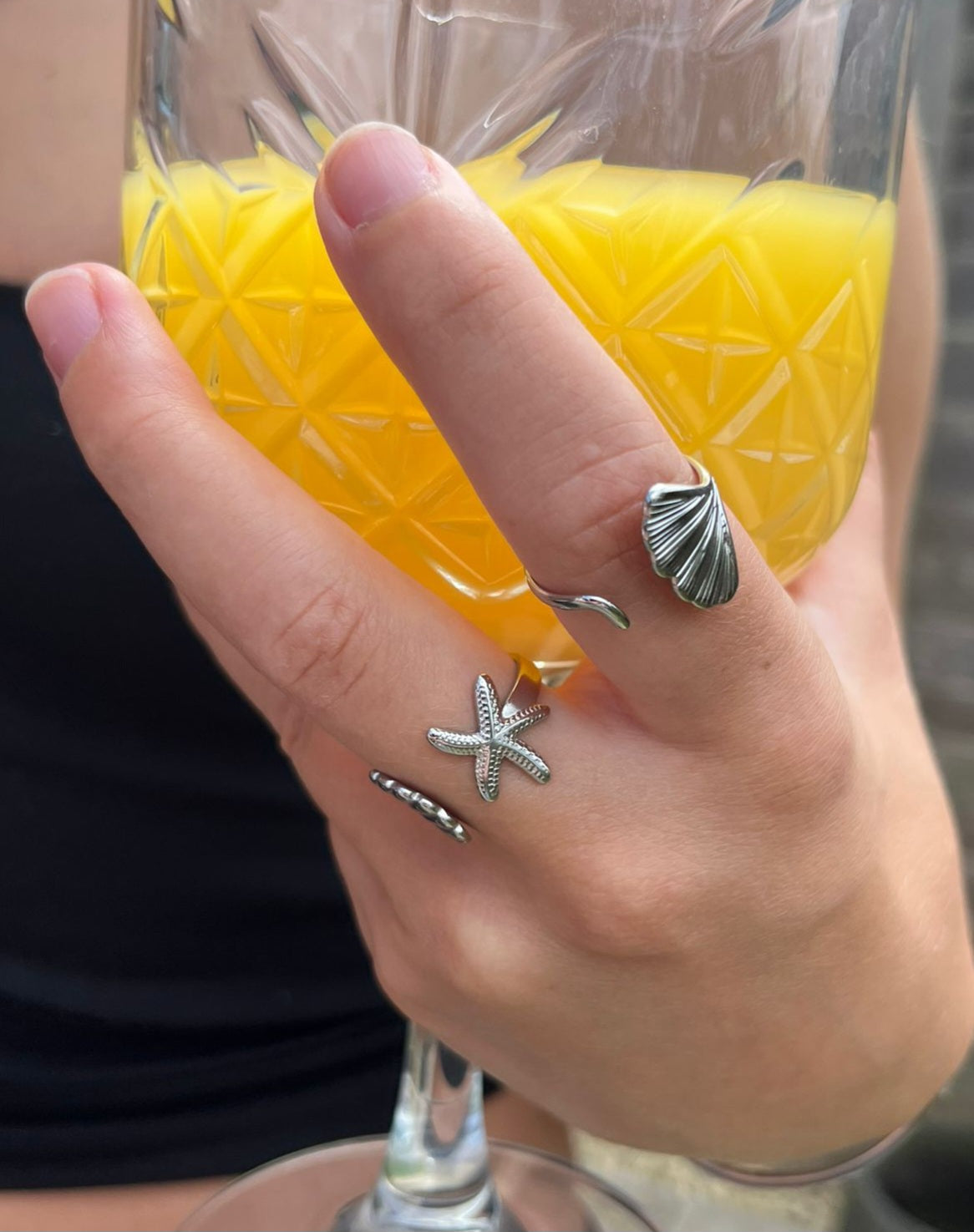 cove is a adjustable silver starfish and shell ring