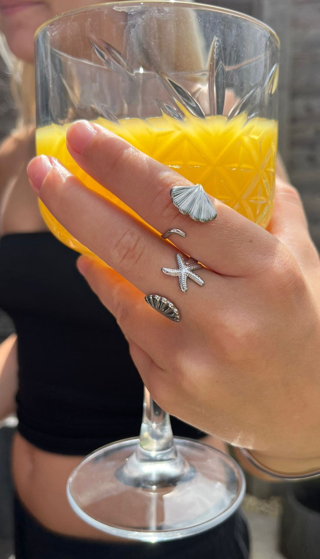 cove is a adjustable silver starfish and shell ring