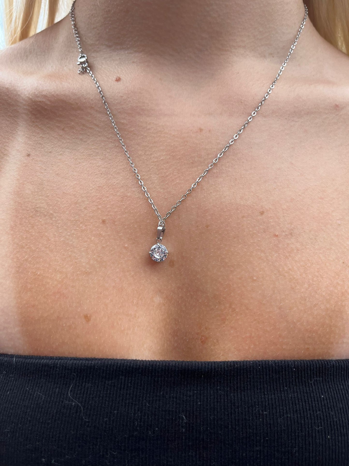 Bess is a stainless steel single circular zirconia diamond