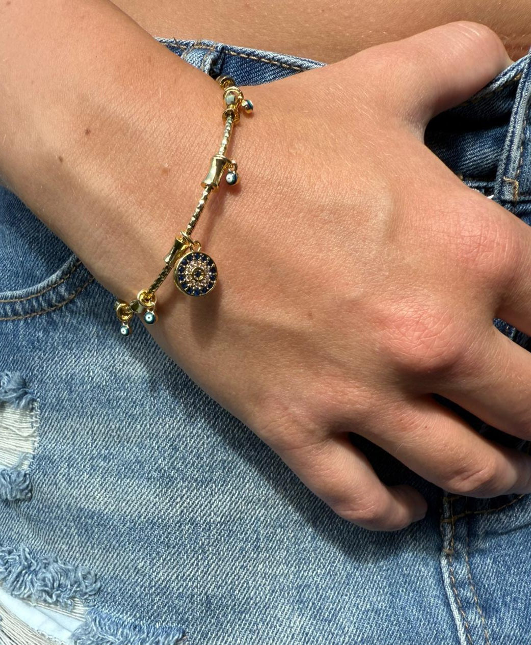 Imogen 18k AAA gold plated Evil eye bangle with lots of small charms
