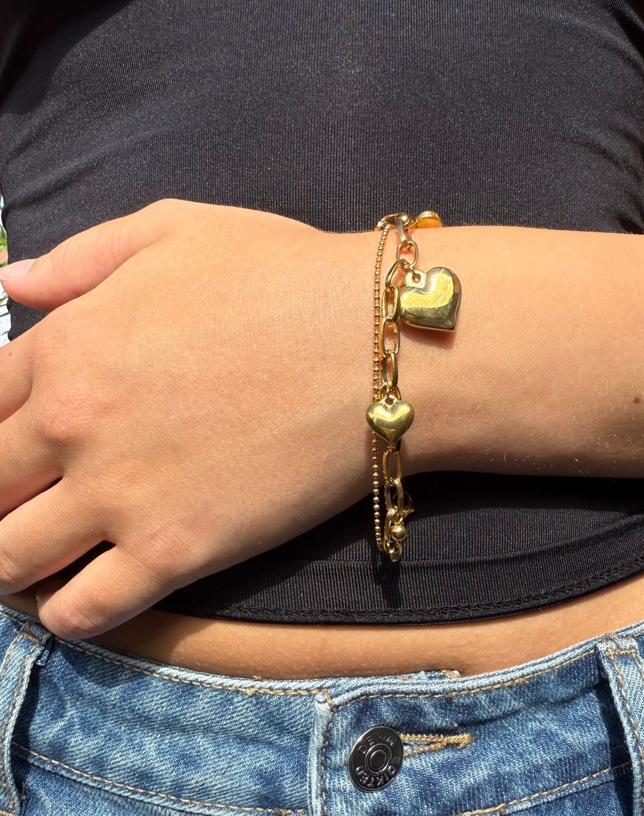 Paloma is a 18k AAA gold plated two chain 3 hearted charmed bracelet