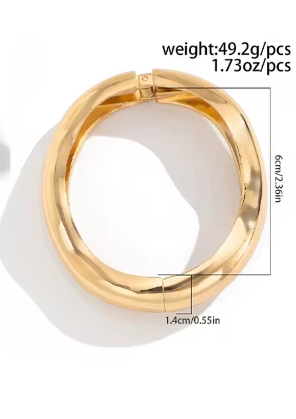 Luella is a wavy gold chunky style bangle