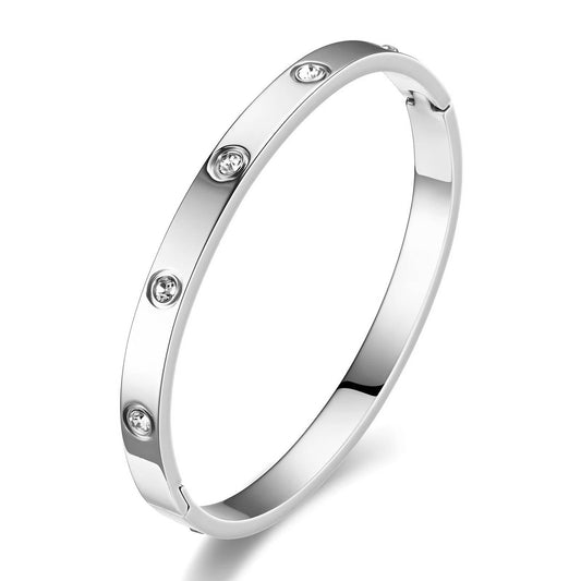 Alice is a stainless steel bangle with added small circular zirconia diamonds