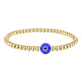 Amelia is a beaded 18K AAA gold bracelet with an evil eye charm