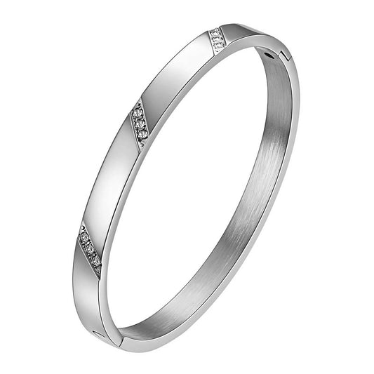 Bella is a stainless steel bangle with small circular zirconia diamonds