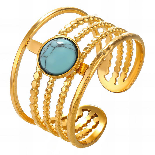 Celia is a 18k AAA gold plated ring with 5 bands of gold and a aqua blue centre stone