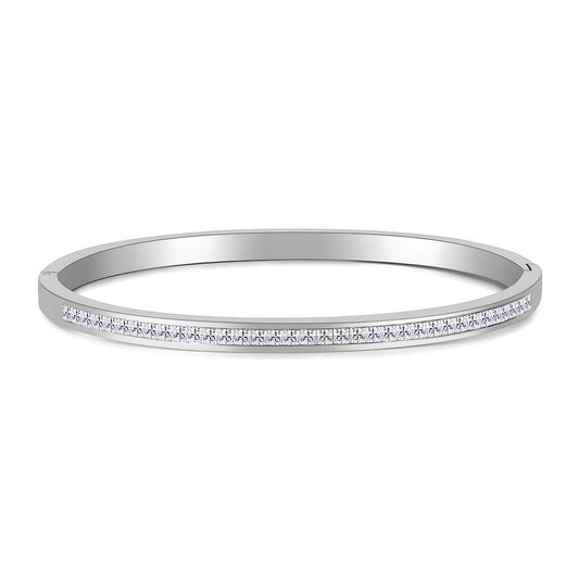 Constance is a stainless steel bangle with a single row of zirconia diamonds
