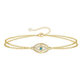 Edie is a 18K AAA gold plated two chain evil eye charm with zirconia diamond bracelet
