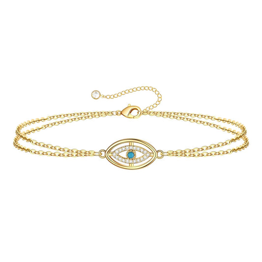 Edie is a 18K AAA gold plated two chain evil eye charm with zirconia diamond bracelet