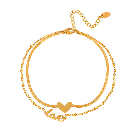 Goldie is a 18k AAA gold plated two chain anklet with a heart and love charm