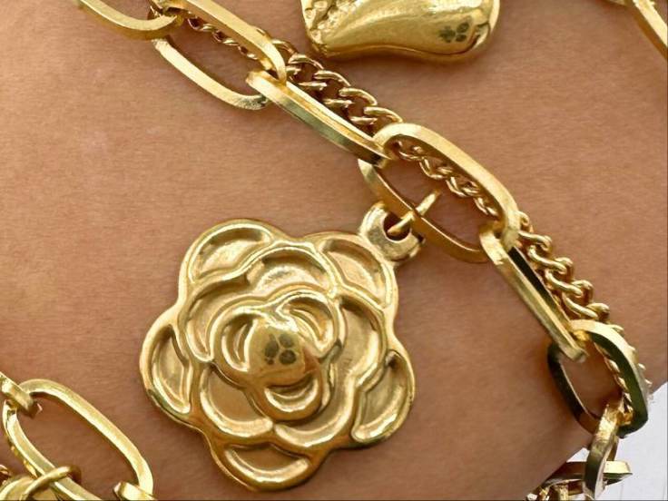 Rosie is a 18K AAA gold plated two chain bracelet with a rose and two crosses as charms