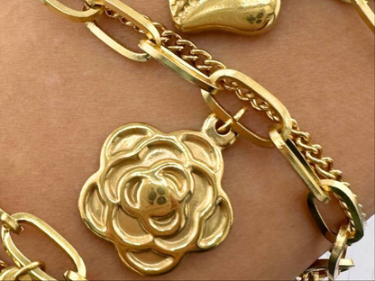 Rosie is a 18K AAA gold plated two chain bracelet with a rose and two crosses as charms