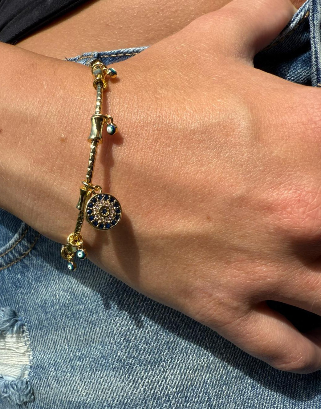 Imogen 18k AAA gold plated Evil eye bangle with lots of small charms