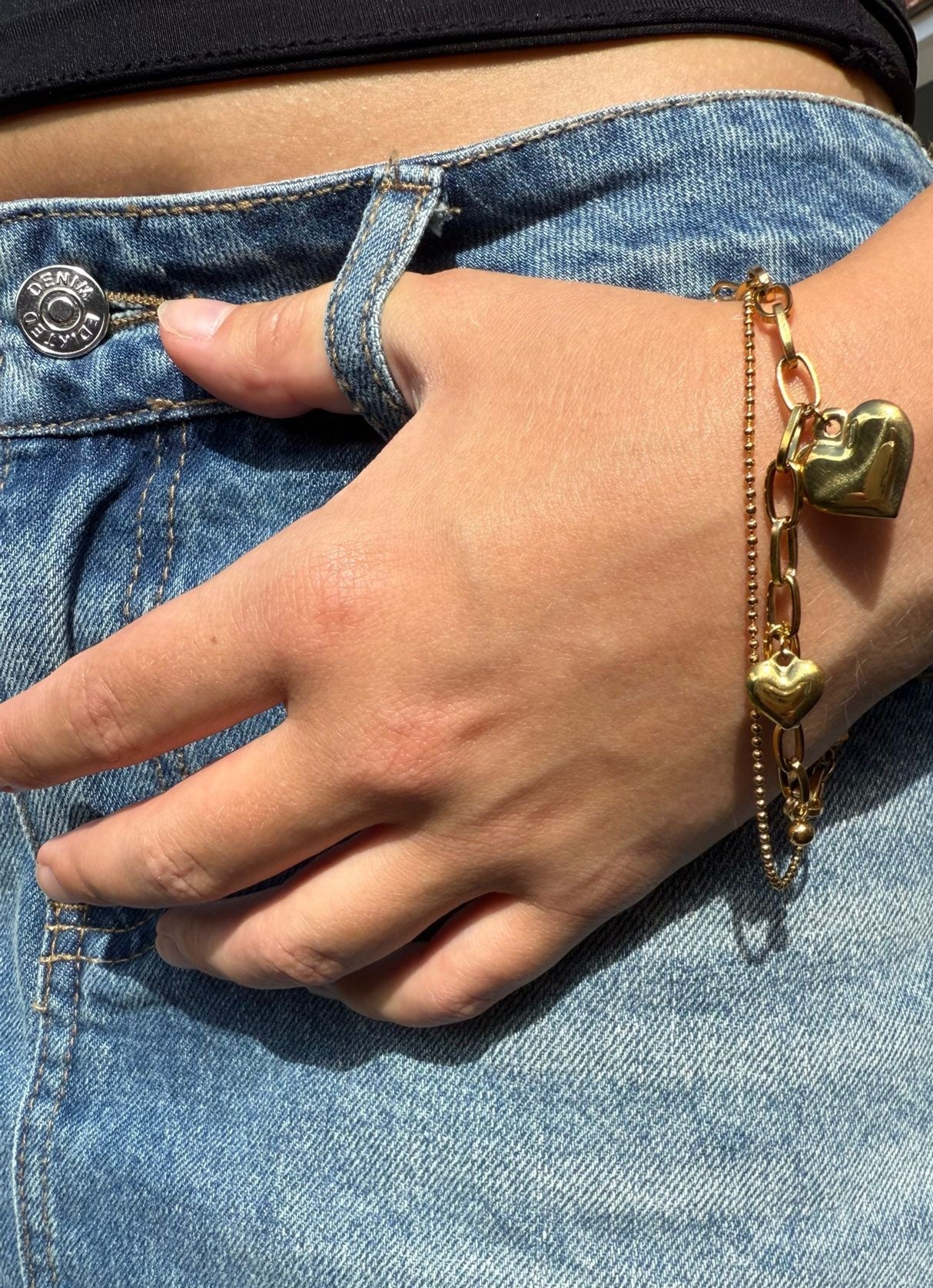 Paloma is a 18k AAA gold plated two chain 3 hearted charmed bracelet