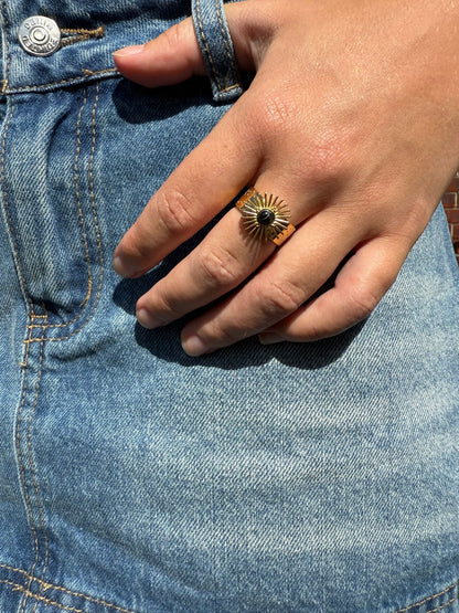 Greer is a 18k AAA gold plated adjustable ring with a sun dial with black stone
