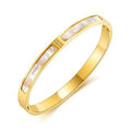 Margo is a 18k AAA gold plated bangle with a white band and small zircon gems