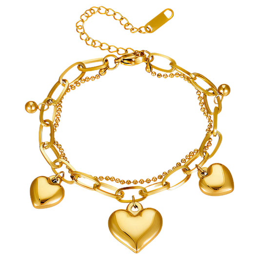 Paloma is a 18k AAA gold plated two chain 3 hearted charmed bracelet