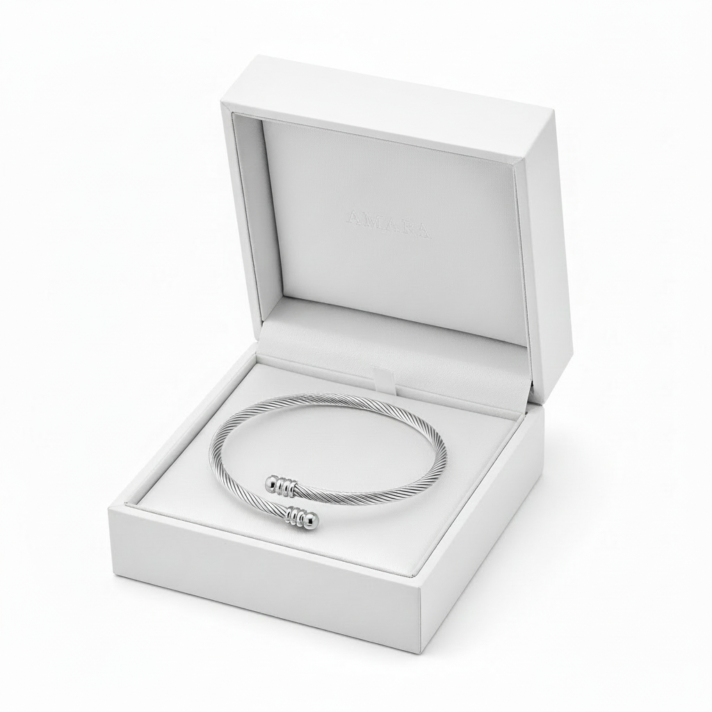Amara Twist Cuff in white gift box with golden crown, no bow