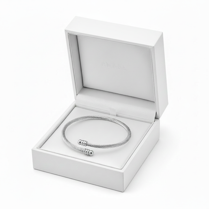 Amara Twist Cuff in white gift box with golden crown, no bow