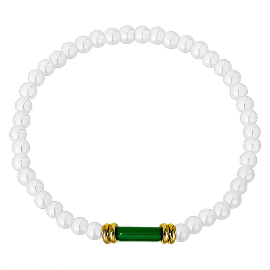 Anastacia is a pearl beaded bracelet with an 18k AAA gold plated beads and a green crystal