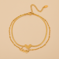 Goldie is a 18k AAA gold plated two chain anklet with a heart and love charm
