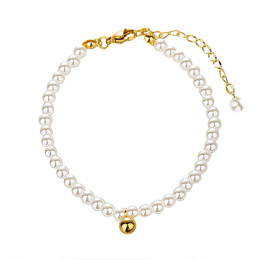 Jupiter is a pearl beaded anklet with 18k AAA gold plated ball bead at the centre